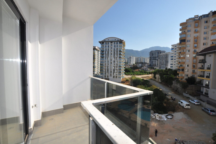 Двухкомнатная квартира в комплексе c инфраструктурой 5-ти звездочного отеля в Махмутларе, 50м2 - Ракурс 6