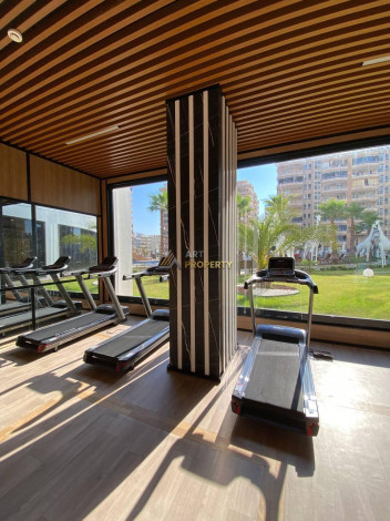 Двухкомнатная квартира в комплексе c инфраструктурой уровня отеля 5 звезд в районе Махмутлар, 55 м2 - Ракурс 19