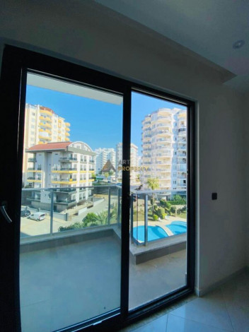 Двухкомнатная квартира в комплексе c инфраструктурой уровня отеля 5 звезд в районе Махмутлар, 55 м2 - Ракурс 23