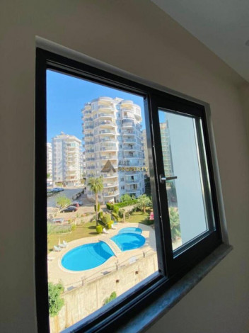 Двухкомнатная квартира в комплексе c инфраструктурой уровня отеля 5 звезд в районе Махмутлар, 55 м2 - Ракурс 27