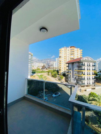 Двухкомнатная квартира в комплексе c инфраструктурой уровня отеля 5 звезд в районе Махмутлар, 55 м2 - Ракурс 29