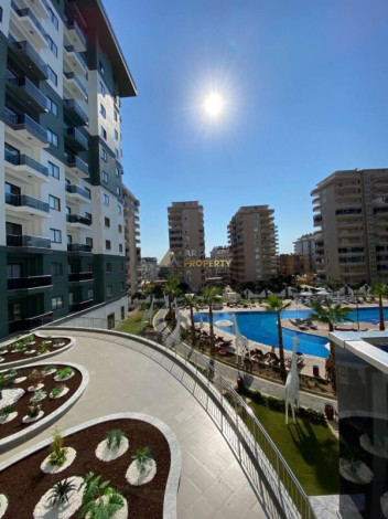 Двухкомнатная квартира в комплексе c инфраструктурой уровня отеля 5 звезд в районе Махмутлар, 55 м2 - Ракурс 38