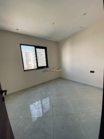 Двухкомнатная квартира в комплексе c инфраструктурой уровня отеля 5 звезд в районе Махмутлар, 55 м2 - Ракурс 45