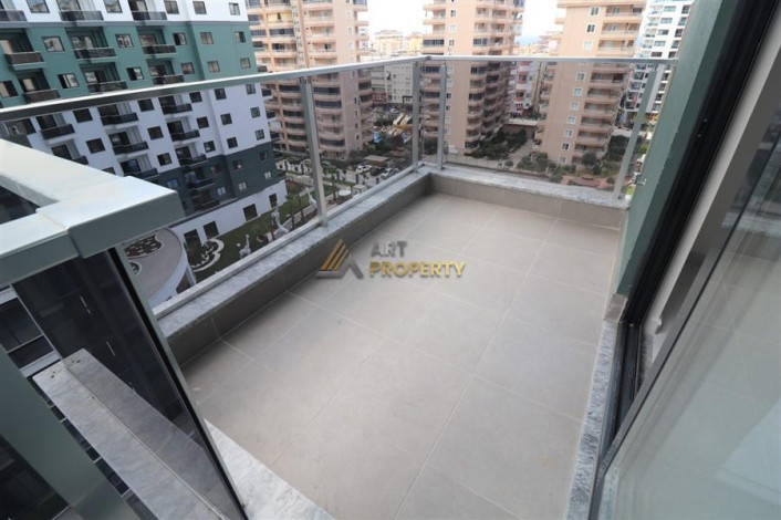 Квартира 2+1 в комплексе c инфраструктурой уровня отеля 5 звезд в районе Махмутлар, 86 м2 - Ракурс 7