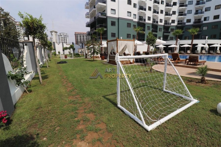 Квартира 2+1 в комплексе c инфраструктурой уровня отеля 5 звезд в районе Махмутлар, 86 м2 - Ракурс 14