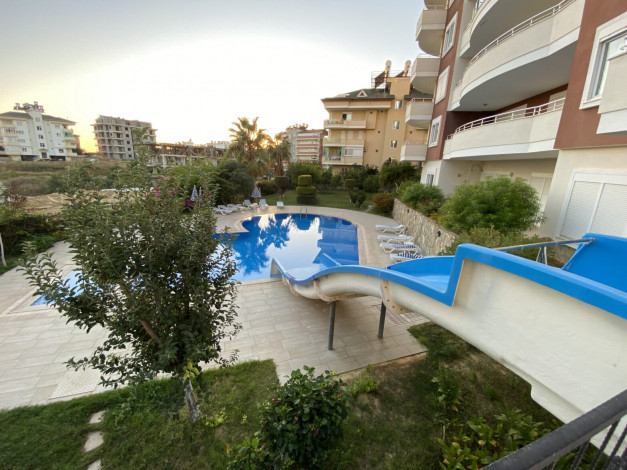 Просторная трехкомнатная квартира с частичным видом на море в районе Авсаллар, 115 м2 - Ракурс 17