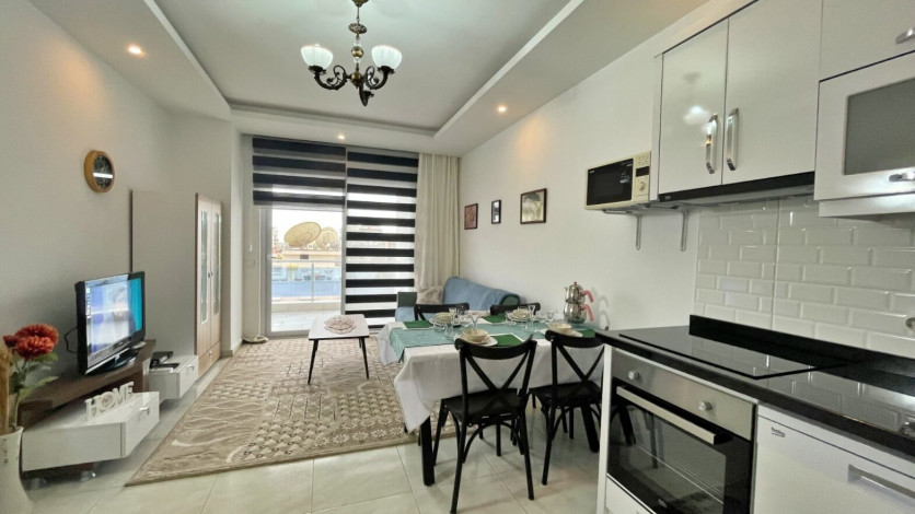 Квартира 1+1 в аренду в районе Махмутлар в комплексе с зимней инфраструктурой, 70 м2 - Ракурс 2