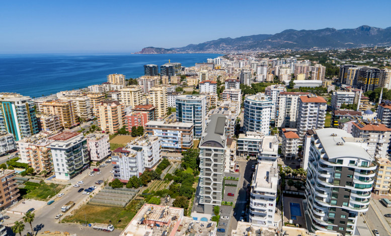 Двухкомнатная квартира в строящемся комплексе в 300 метрах от моря в Махмутлар, 55 м2 - Ракурс 3