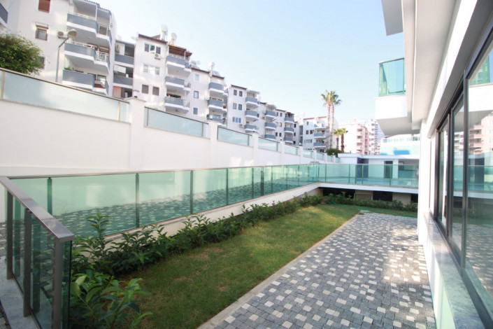 Квартиры 1+1 и 2+1 на первой линии моря в районе Махмутлар, 55 -100 м2 - Ракурс 7