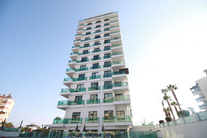 Квартиры 1+1 и 2+1 на первой линии моря в районе Махмутлар, 55 -100 м2 - Ракурс 9