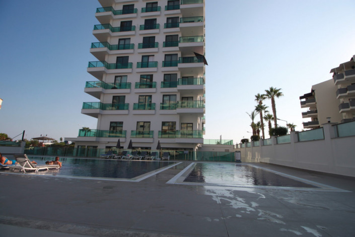 Квартиры 1+1 и 2+1 на первой линии моря в районе Махмутлар, 55 -100 м2 - Ракурс 10