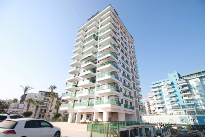 Квартиры 1+1 и 2+1 на первой линии моря в районе Махмутлар, 55 -100 м2 - Ракурс 13