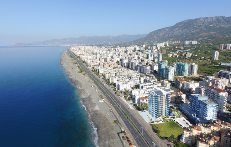 Квартиры 1+1 и 2+1 на первой линии моря в районе Махмутлар, 55 -100 м2 - Ракурс 18