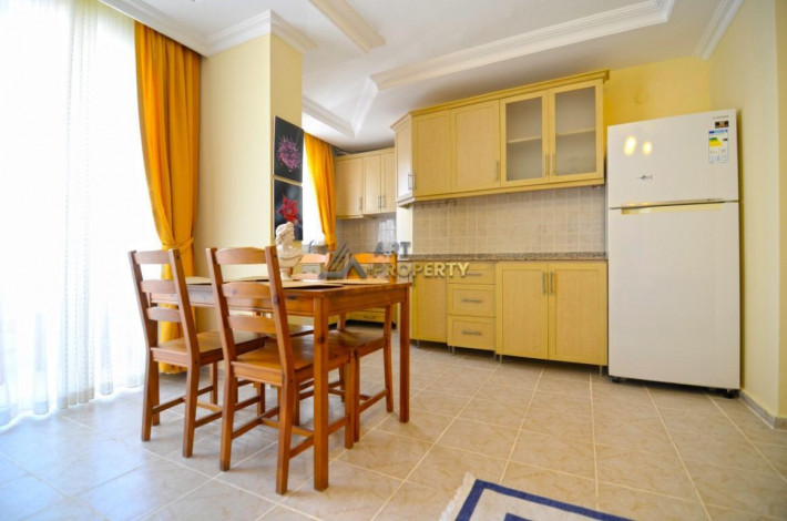 Полностью меблированная двухкомнатная квартира на 6 этаже в Махмутлар, 65 м2 - Ракурс 18