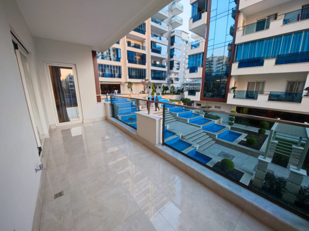 Полностью меблированная трехкомнатная квартира в комплексе премиум класса в районе Махмутлар, 110м - Ракурс 3