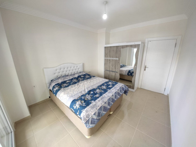 Меблированная двухкомнатная квартира с крытым бассейном в комплексе в районе Махмутлар, 60 м2 - Ракурс 5