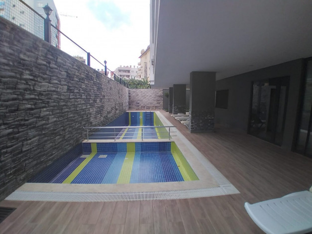 Квартира 1+1 в новом доме в 250 м от моря в Махмутлар, 60 м2 - Ракурс 18