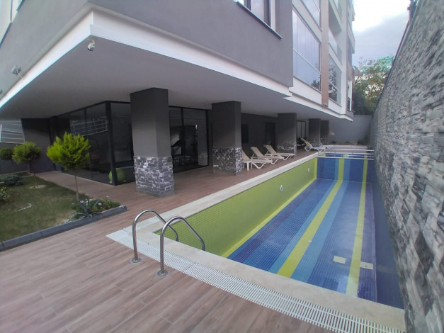 Квартира 1+1 в новом доме в 250 м от моря в Махмутлар, 60 м2 - Ракурс 21