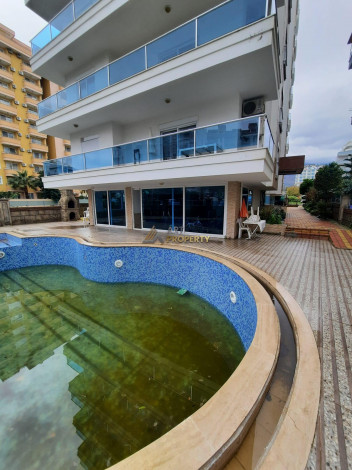 Квартира 2+1 с новой мебелью вблизи моря в Махмутларе, 90 м2 - Ракурс 16