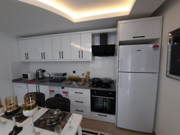 Квартира 2+1 с новой мебелью вблизи моря в Махмутларе, 90 м2 - Ракурс 21