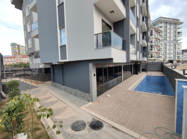 Двухкомнатная квартира в новом комплексе на побережье Средиземного моря в районе Махмутлар, 55 м2 - Ракурс 3