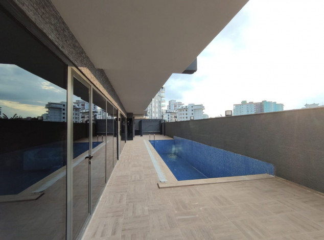 Двухкомнатная квартира в новом комплексе на побережье Средиземного моря в районе Махмутлар, 55 м2 - Ракурс 8