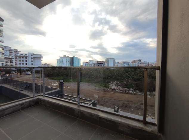 Двухкомнатная квартира в новом комплексе на побережье Средиземного моря в районе Махмутлар, 55 м2 - Ракурс 18