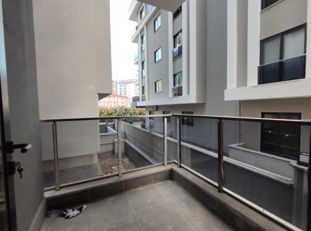 Двухкомнатная квартира в новом комплексе на побережье Средиземного моря в районе Махмутлар, 55 м2 - Ракурс 20