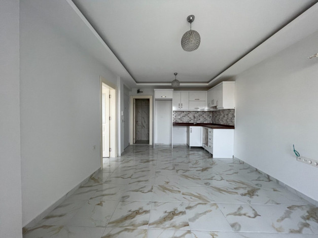 Двухкомнатная квартира в динамично развивающемся районе Махмутлар,60 м2 - Ракурс 3