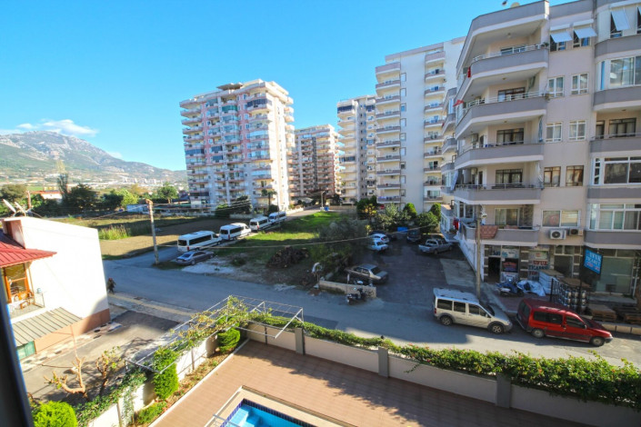 Квартира 1+1 в центральной части Махмутлара с отличной планировкой с мебелью, 70 м2 - Ракурс 16