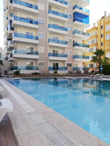 Квартира 1+1 в комплексе с развитой инфраструктурой в Махмутларе, 60 м2 - Ракурс 14