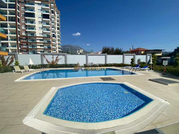 Квартира 1+1 с новой мебелью в Махмутларе, 55 м2 - Ракурс 6