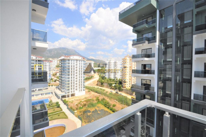 Трехкомнатная квартира в комплексе c инфраструктурой отельного уровня в районе Махмутлар, 88 м2 - Ракурс 26