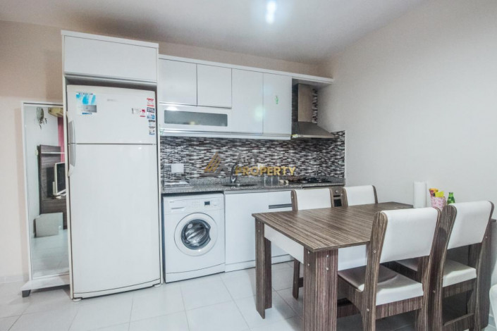 Срочная продажа квартиры 1+1 с мебелью в центре Махмутлара, 55 м2 - Ракурс 24