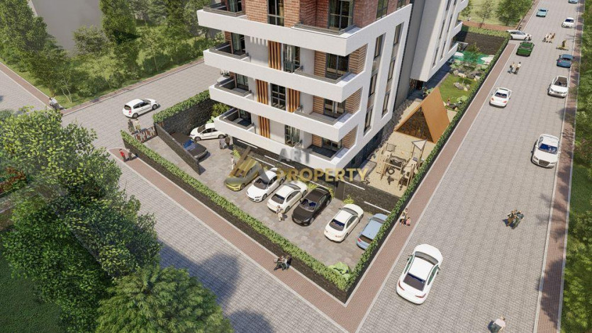 Cовременный инвестиционный проект у моря в центре Махмутлара, 60-130 м2 - Ракурс 21