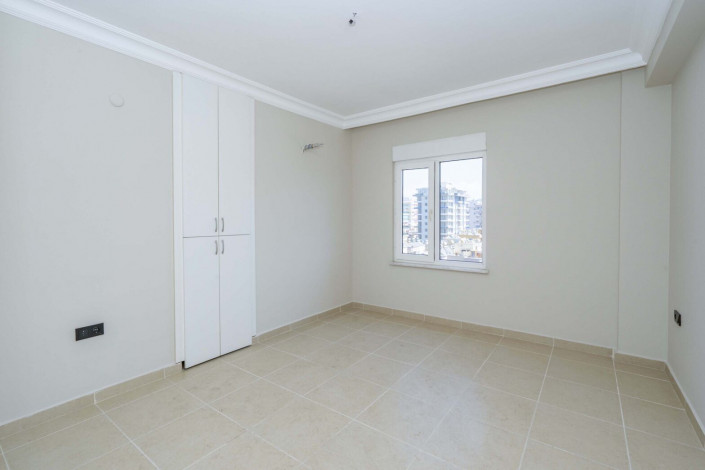 Трехкомнатная квартира на высоком этаже с видом на море в районе Махмутлар, 120 м2 - Ракурс 12