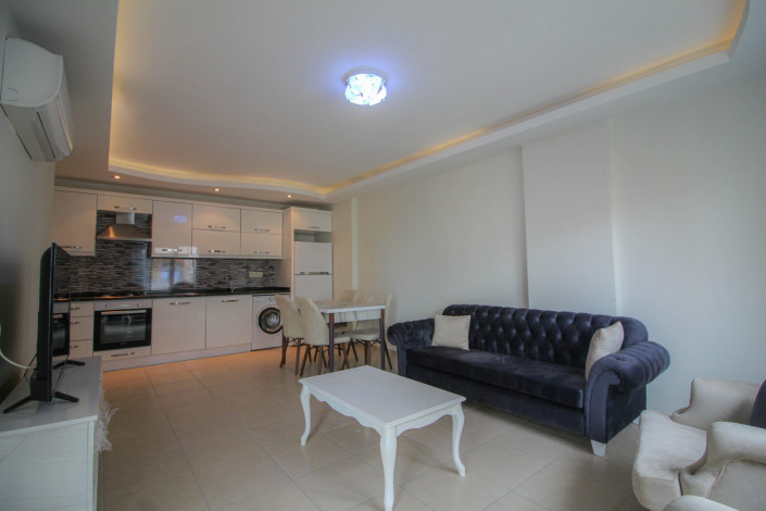 Квартира 1+1 с мебелью в центральной части района Махмутлар, 70 м2 - Ракурс 2