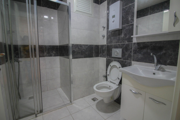 Квартира 1+1 с мебелью в центральной части района Махмутлар, 70 м2 - Ракурс 14