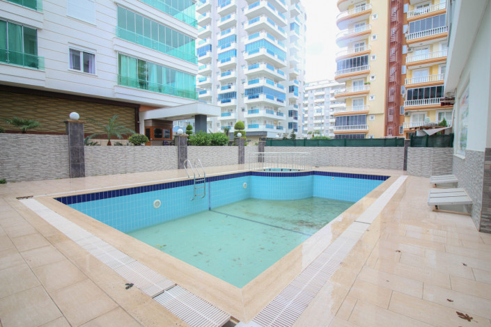 Квартира 1+1 с мебелью в центральной части района Махмутлар, 70 м2 - Ракурс 19