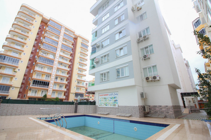 Квартира 1+1 с мебелью в центральной части района Махмутлар, 70 м2 - Ракурс 20