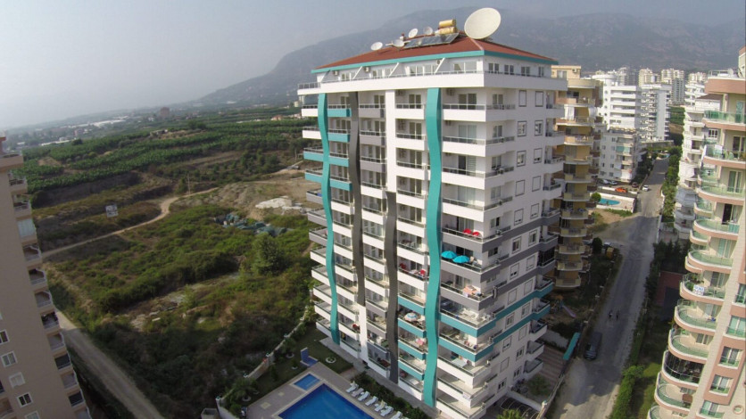 Двухкомнатная квартира вблизи от моря и вторничного рынка в Махмутларе, 67 м2 - Ракурс 16