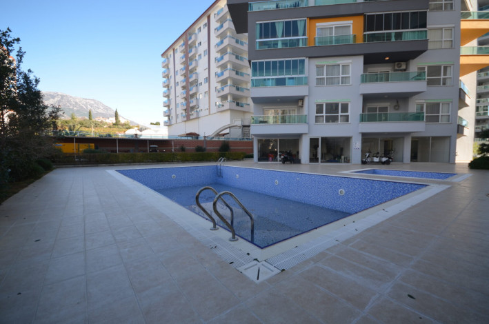 Большая по площади двухкомнатная квартира в Махмутларе, 75 м2 - Ракурс 19