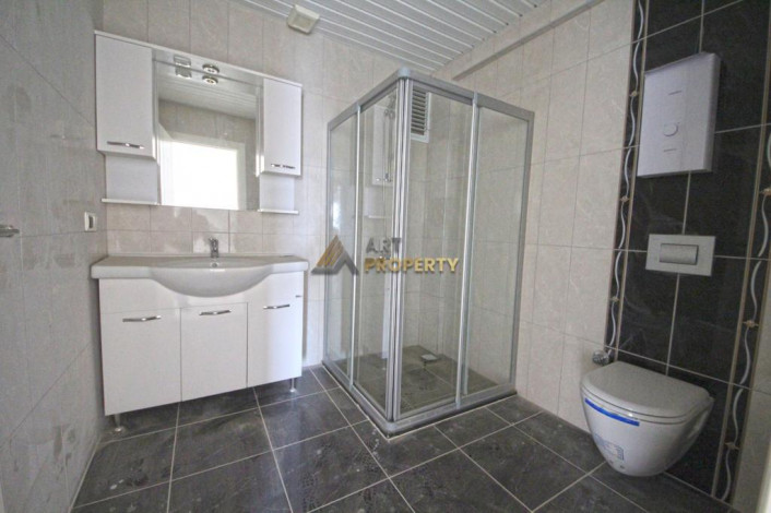 Двухкомнатная квартира на высоком этаже с частичным видом на море в Махмутлар, 70 м2 - Ракурс 14