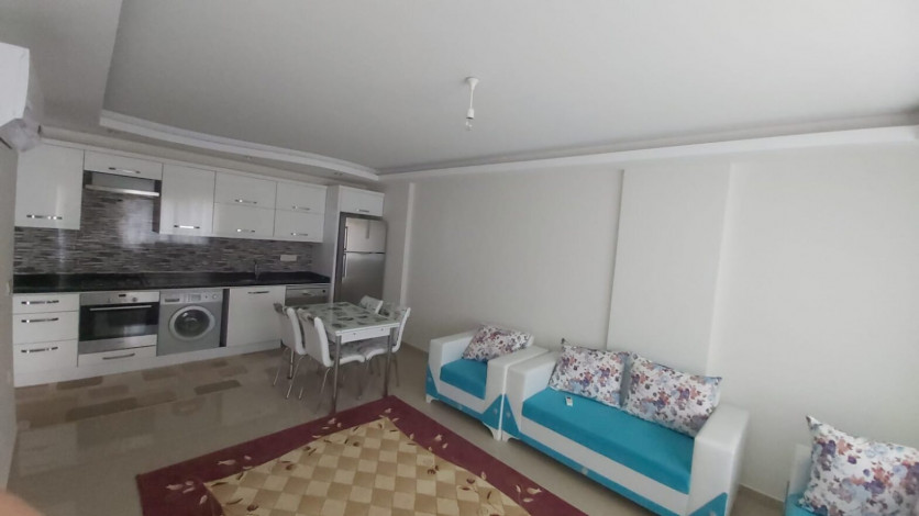 Меблированная двухкомнатная квартира в центре района Махмутлар, 50 м2 - Ракурс 2