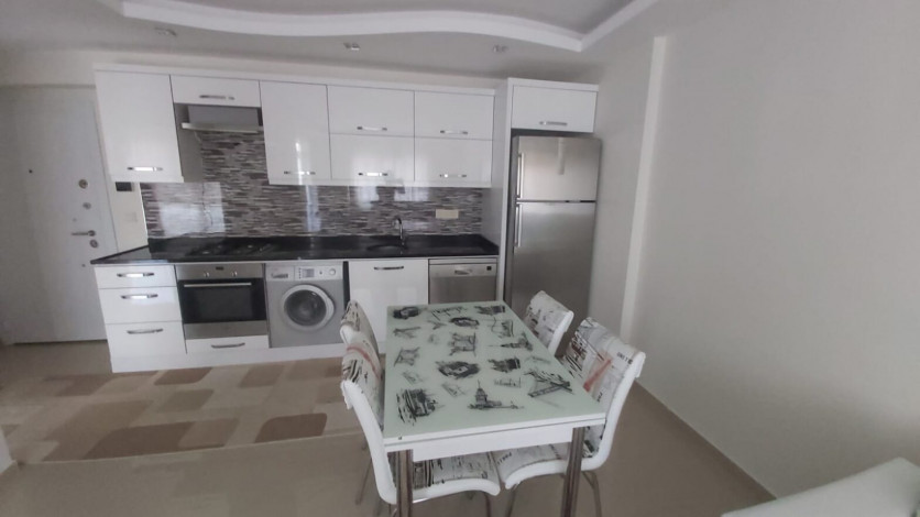 Меблированная двухкомнатная квартира в центре района Махмутлар, 50 м2 - Ракурс 4