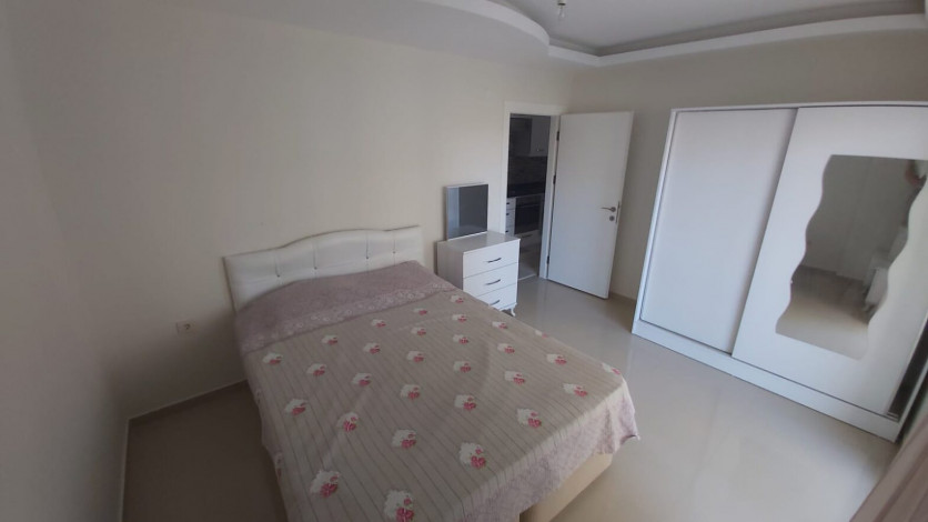 Меблированная двухкомнатная квартира в центре района Махмутлар, 50 м2 - Ракурс 10