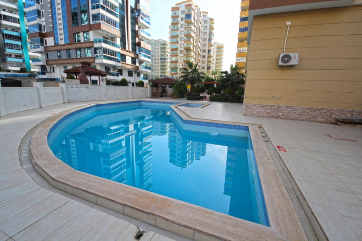 Трехкомнатная квартира в хорошем комплексе в районе Махмутлар, 100 м2 - Ракурс 23