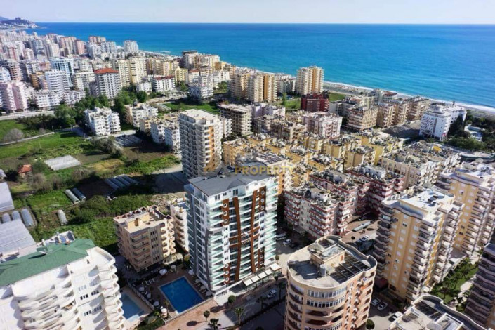 Трехкомнатная квартира с частичным видом на море в люксовом комплексе в Махмутлар, 110 м2 - Ракурс 6