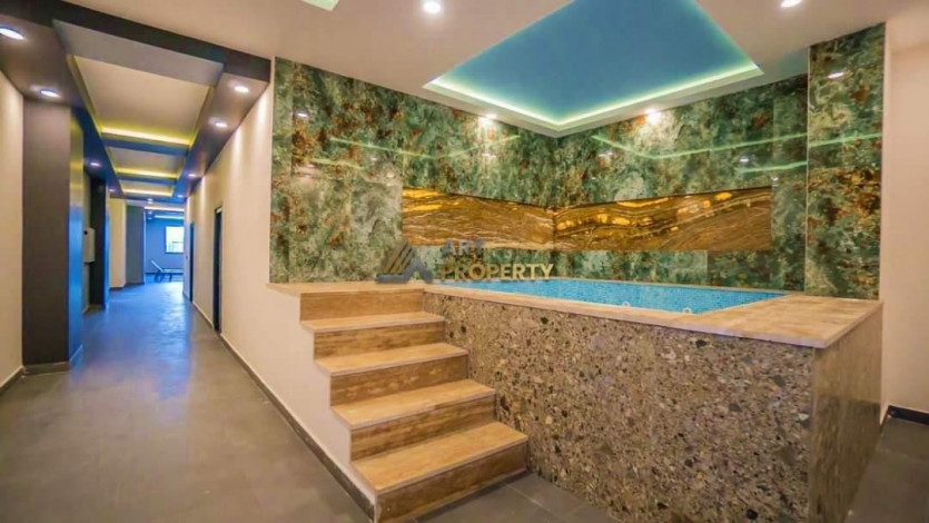 Трехкомнатная квартира с частичным видом на море в люксовом комплексе в Махмутлар, 110 м2 - Ракурс 7