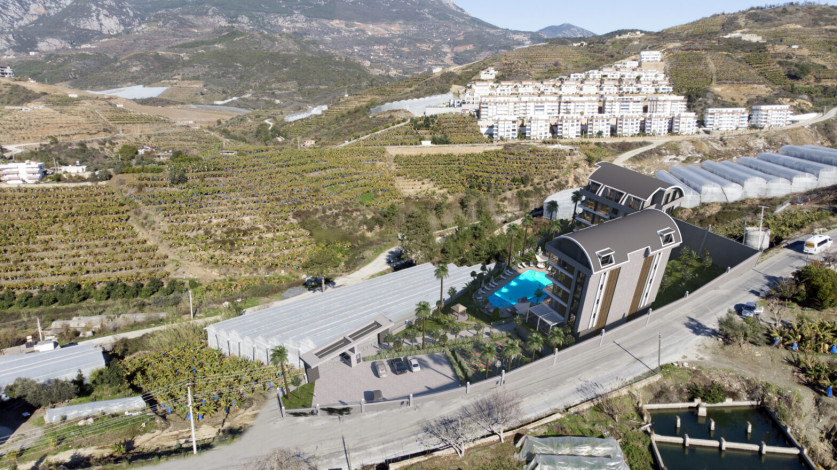 Новый проект жилых домов в красивом зеленом районе Каргыджак, 48-140 м2 - Ракурс 17